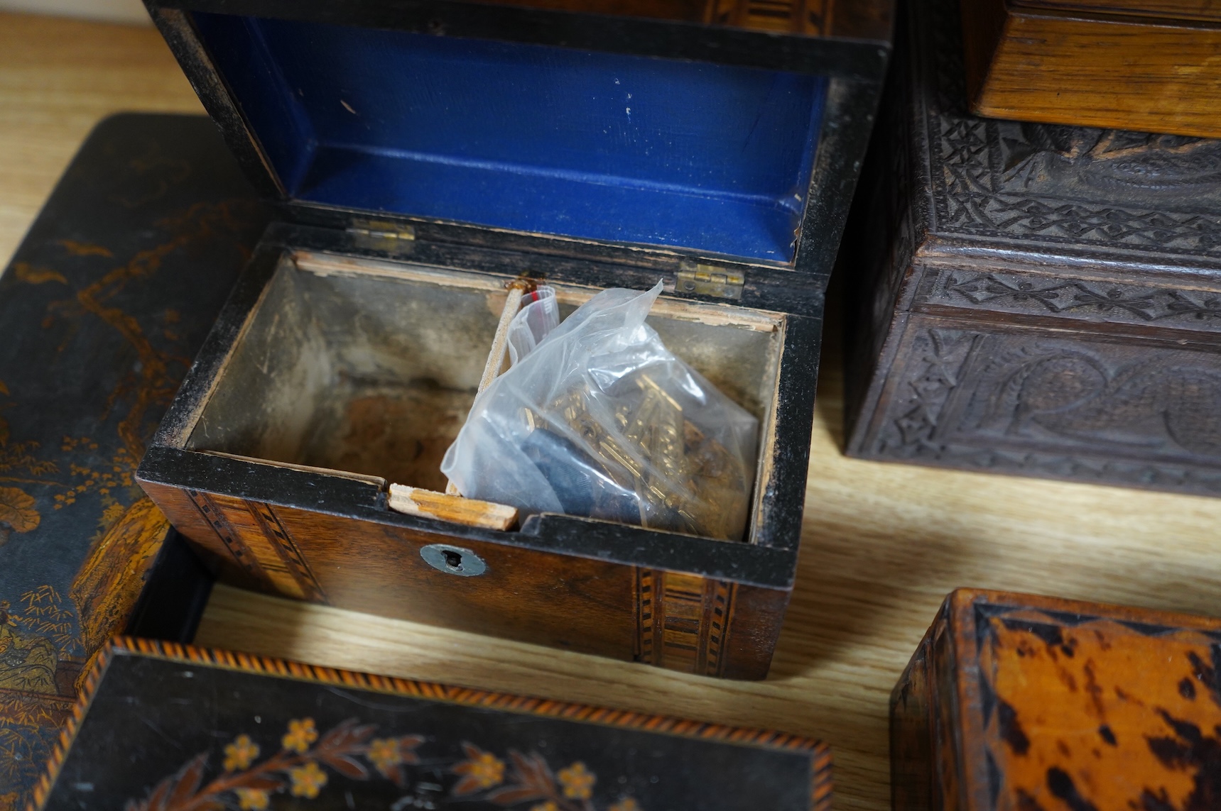 A blonde tortoiseshell veneered box, six other boxes and a miniature bagatelle board
